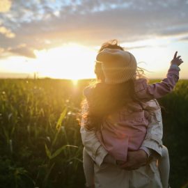 Mother with daughter in a field