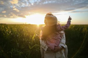 Mother with daughter in a field