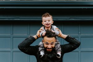 Dad with son on his shoulders