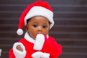 Baby wearing Santa outfit