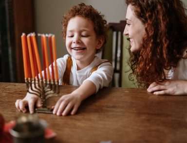Mother and son celebrating Hanukkah
