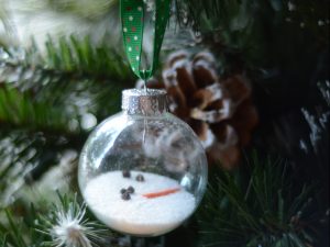 Melted snowman in ball ornament