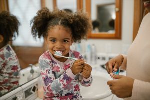 Girl brushing teeth