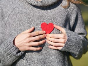 Woman holding heart