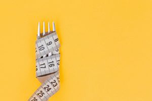 Fork with measuring tape wrapped around