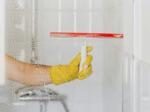 Person cleaning shower