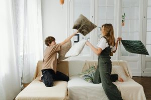 Siblings having a pillow fight