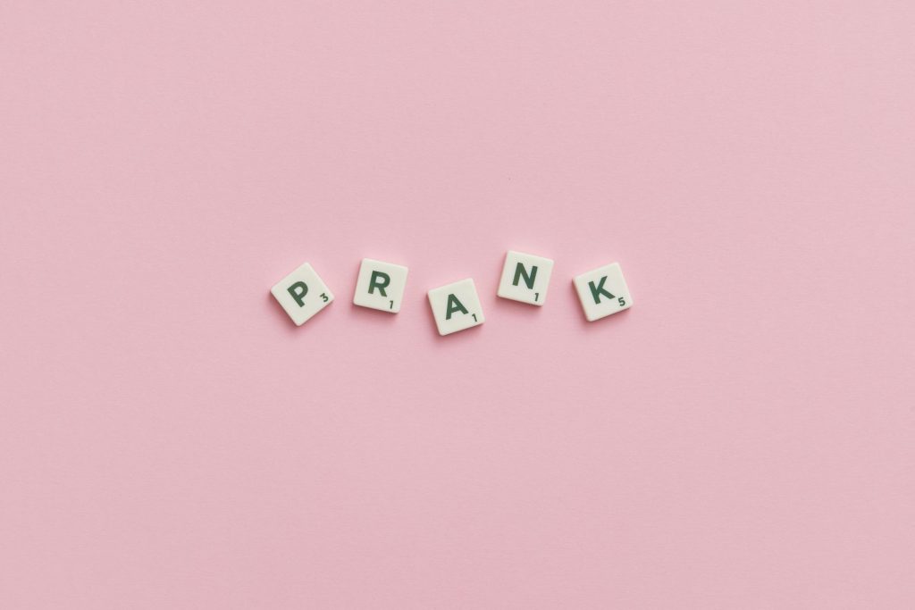 The word prank spelled out on pink background