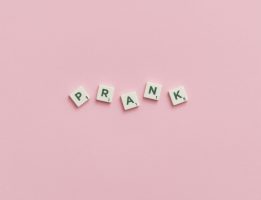 The word prank spelled out on pink background