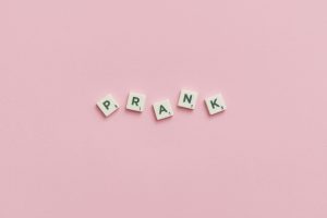 The word prank spelled out on pink background