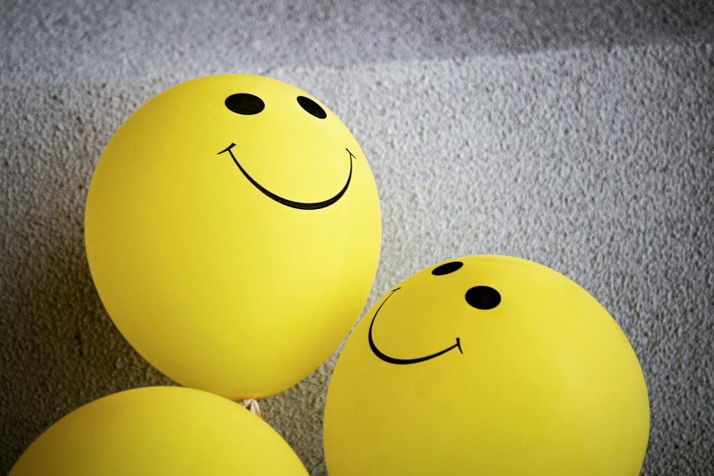 Yellow smiling balloons