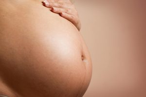 Close up of pregnant stomach