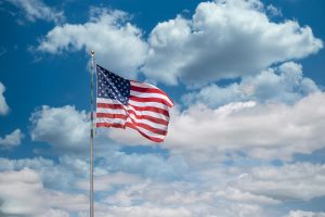 American flag waving in sky