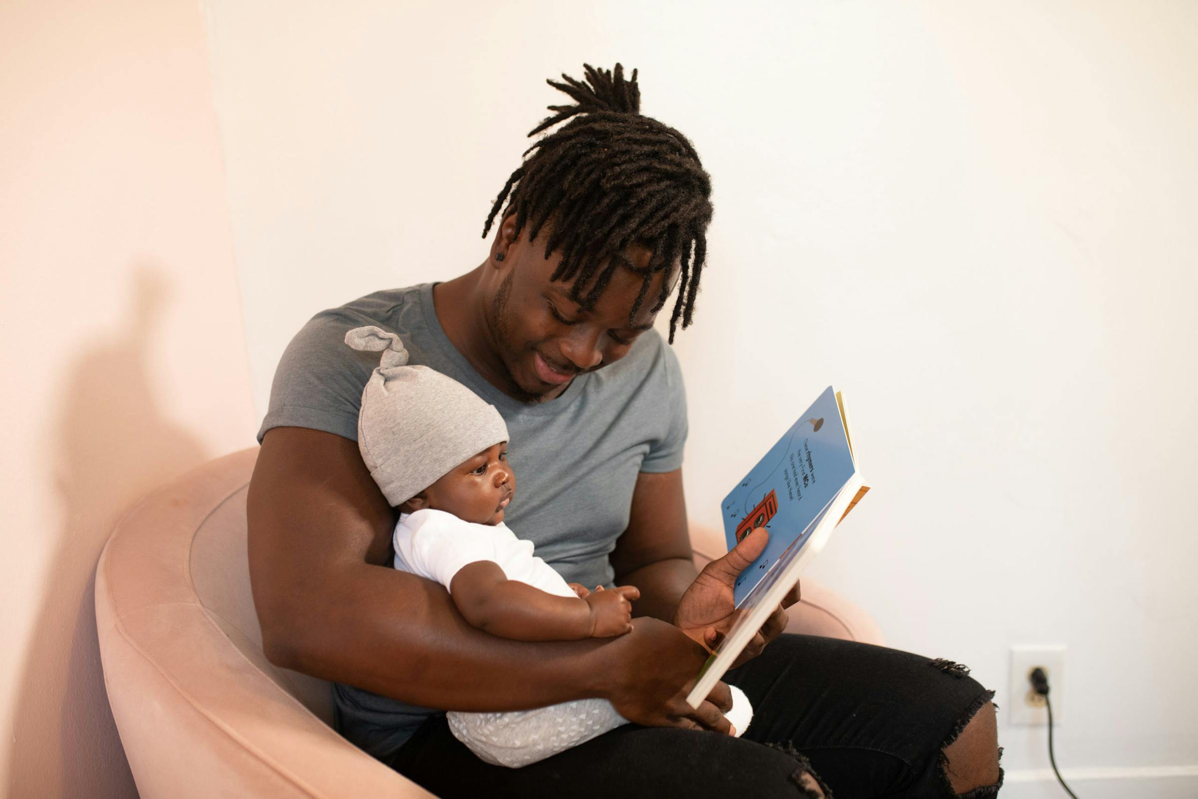 Father reading to his baby