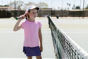 Young girl playing tennis