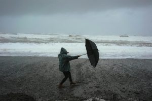 Person on beach in a storm