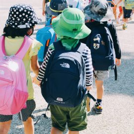 Young kids wearing backpacks