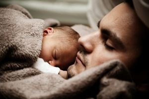 Dad cuddling with baby