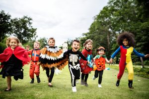 Kids on in Halloween costumes