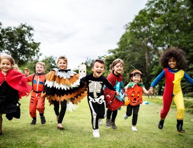 Kids on in Halloween costumes