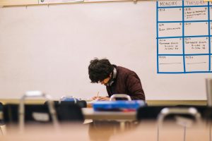Kid writing in school